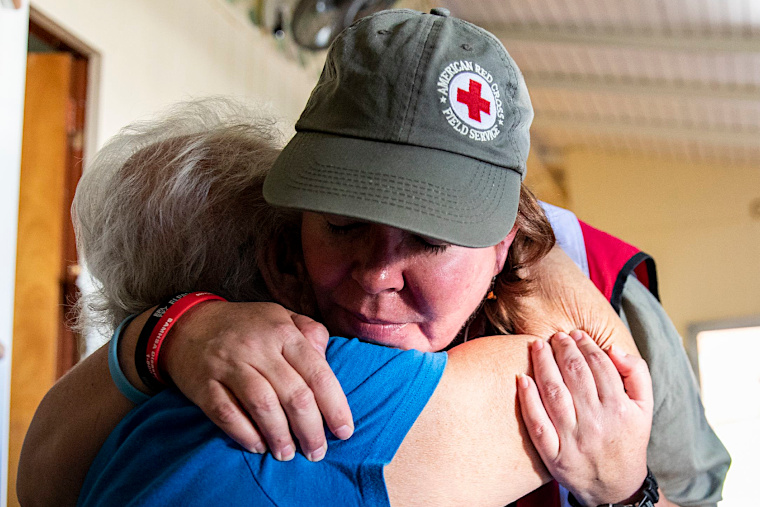 January 17, 2020. Guánica, Puerto Rico.
Red Cross volunteers comfort Ms. Hernandez who was brought to tears upon entering her home for the first time since the earthquakes began. Leonor and 9 other family members have been sleeping in her niece Emmas backyard because they fear that another earthquake may destroy their damaged home.
Photo by Scott Dalton/American Red Cross